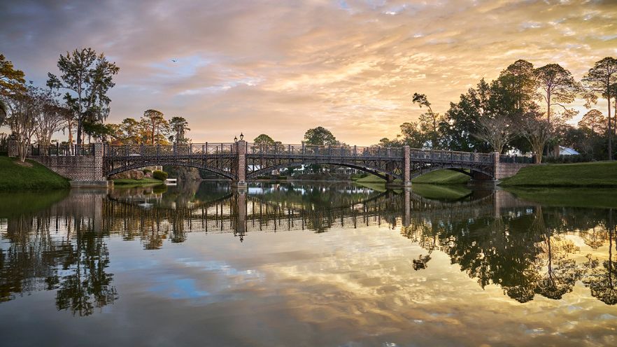 bridge over water at sunset